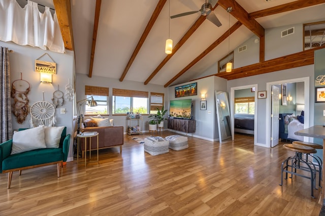 living room featuring ceiling fan, beam ceiling, high vaulted ceiling, and hardwood / wood-style floors