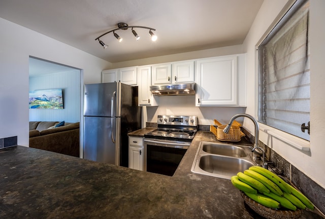 kitchen with appliances with stainless steel finishes, white cabinetry, and sink