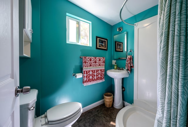 bathroom with toilet, tile patterned floors, and a shower with shower curtain