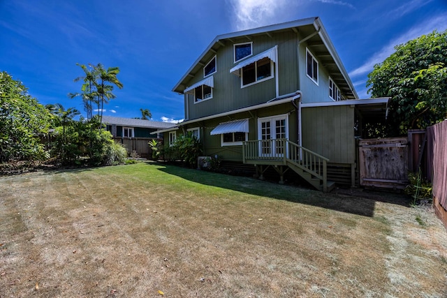 back of property featuring a yard