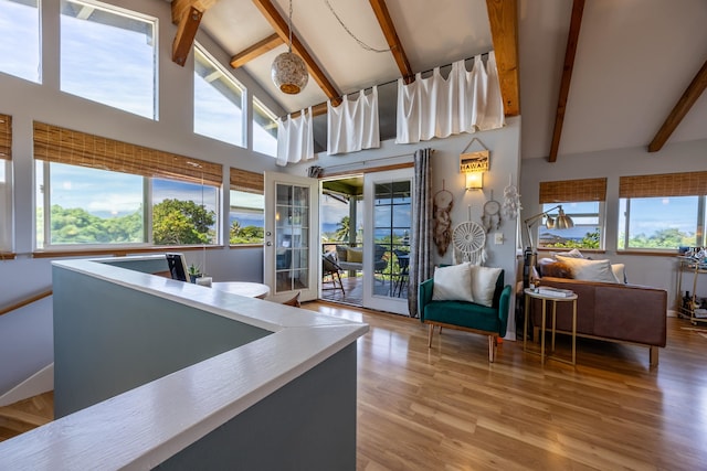 interior space featuring beamed ceiling and plenty of natural light