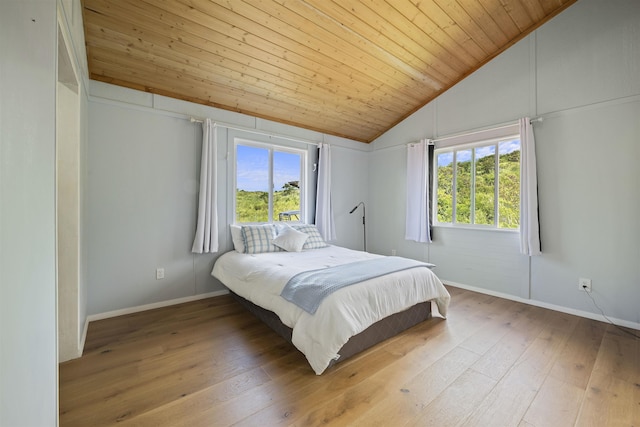 34701 Piilani Hwy, Hana, HI 96713 - bedroom with lofted ceiling, wood ceiling, baseboards, and hardwood / wood-style flooring