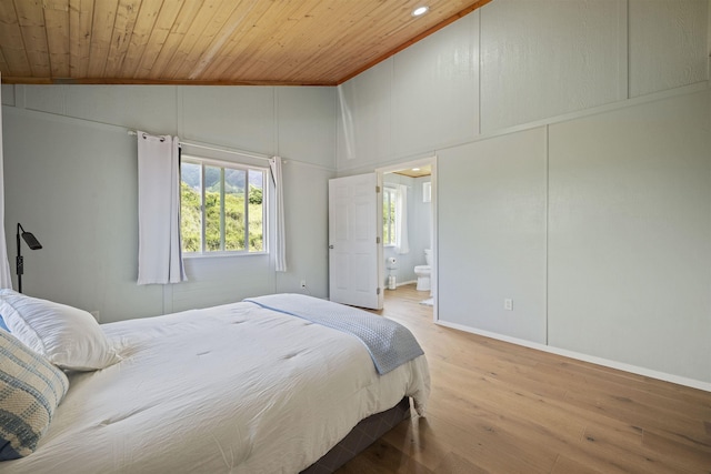 34701 Piilani Hwy, Hana, HI 96713 - bedroom with wooden ceiling, vaulted ceiling, wood finished floors, baseboards, and ensuite bathroom