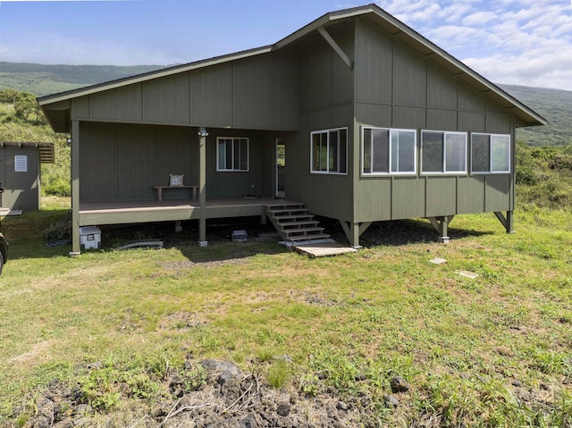 34701 Piilani Hwy, Hana, HI 96713 - rear view of property with a yard and a deck
