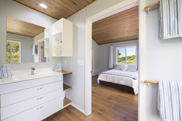 34701 Piilani Hwy, Hana, HI 96713 - bathroom featuring wood ceiling, wood finished floors, vanity, recessed lighting, and baseboards
