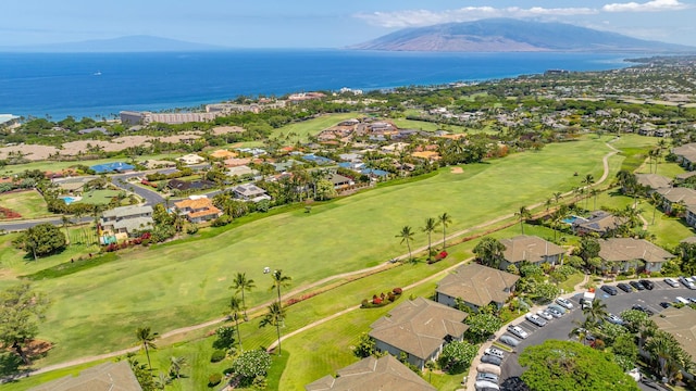 drone / aerial view with a water and mountain view