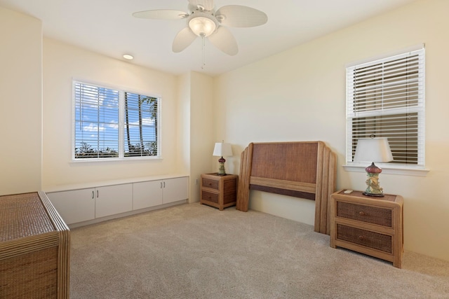 carpeted bedroom featuring ceiling fan