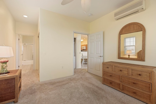 carpeted bedroom with ceiling fan and a wall mounted air conditioner