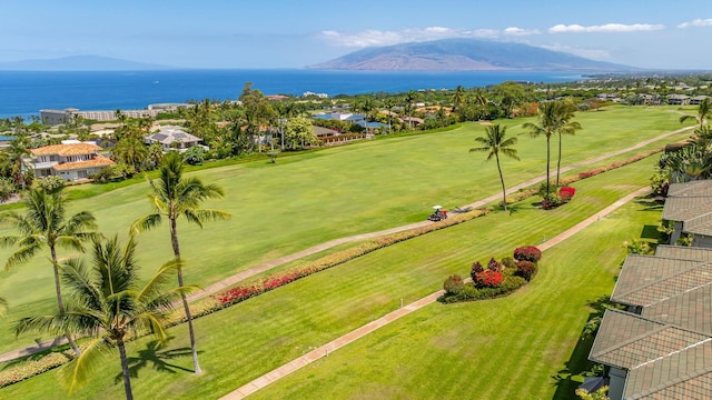 birds eye view of property with a water and mountain view