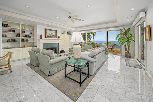 212 Crestview Rd, Lahaina, HI 96761 - living area with a tray ceiling, light marble finish flooring, a ceiling fan, a fireplace, and recessed lighting