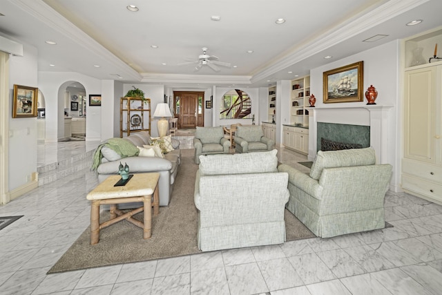 212 Crestview Rd, Lahaina, HI 96761 - living area featuring light marble finish flooring, a tray ceiling, ceiling fan, arched walkways, and recessed lighting