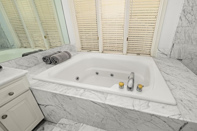 212 Crestview Rd, Lahaina, HI 96761 - bathroom featuring a whirlpool tub, vanity, and marble finish floors