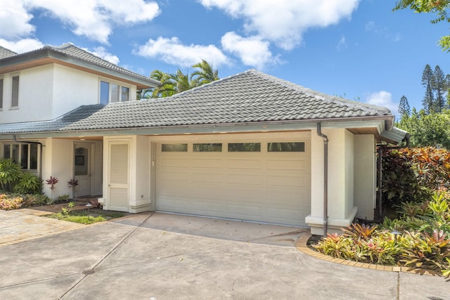 212 Crestview Rd, Lahaina, HI 96761 - view of side of property with a tile roof, stucco siding, and driveway