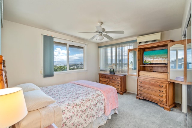 1125 Hoomau Pl, Wailuku, HI 96793 - bedroom featuring a wall unit AC, multiple windows, light colored carpet, and a ceiling fan