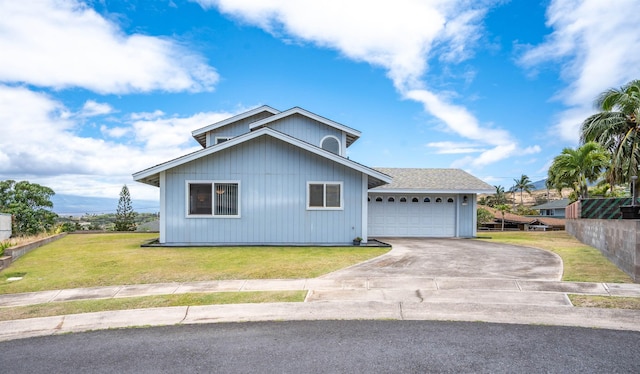 1125 Hoomau Pl, Wailuku, HI 96793 - view of front of house with driveway, a front lawn, and a garage