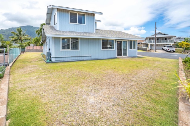 1125 Hoomau Pl, Wailuku, HI 96793 - view of front facade with a shingled roof and a mountain view