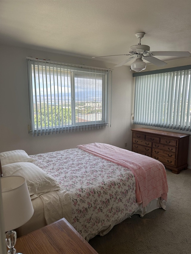 carpeted bedroom with a ceiling fan