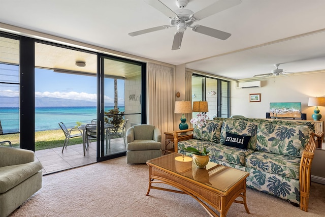 carpeted living room with ceiling fan, expansive windows, a wall mounted AC, and a water view