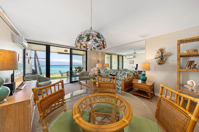 dining space with a wall of windows, a wall unit AC, carpet flooring, and ceiling fan