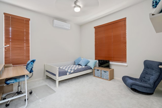 bedroom with carpet, a wall mounted AC, and ceiling fan