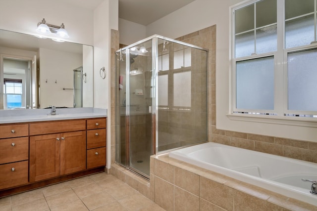 bathroom with vanity, tile patterned flooring, and separate shower and tub