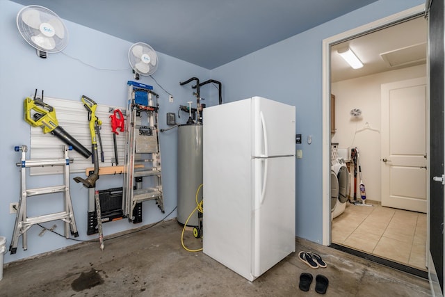 utility room featuring washing machine and dryer and water heater