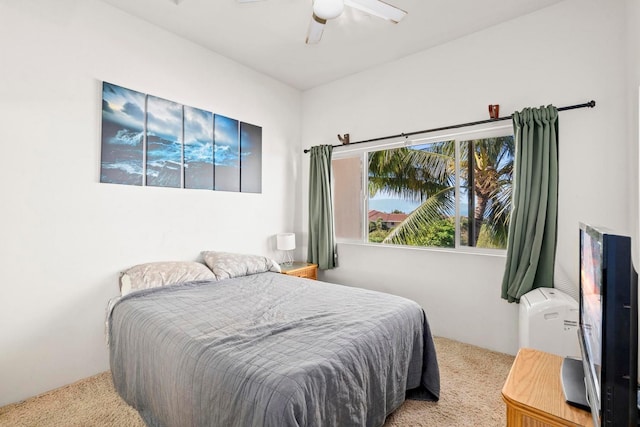 bedroom featuring ceiling fan and light colored carpet