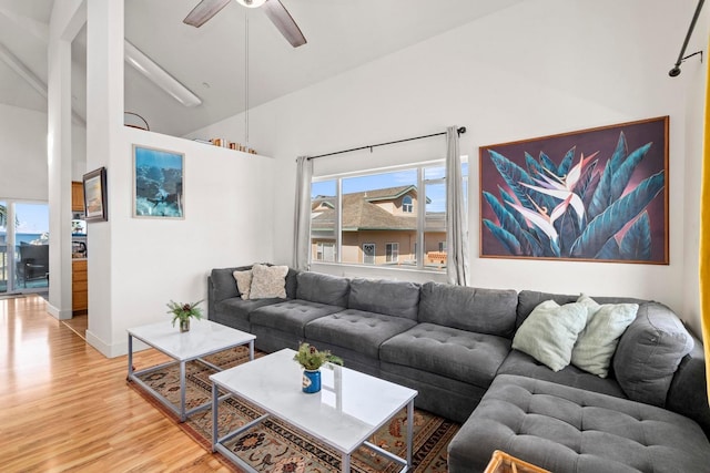 living room featuring ceiling fan and hardwood / wood-style flooring