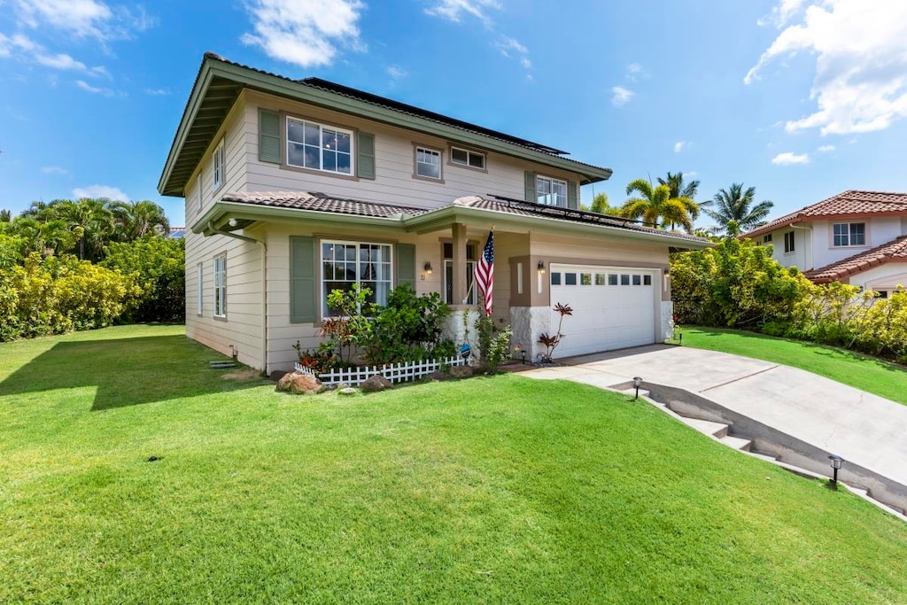 view of front of house featuring a front lawn, a garage, and a porch