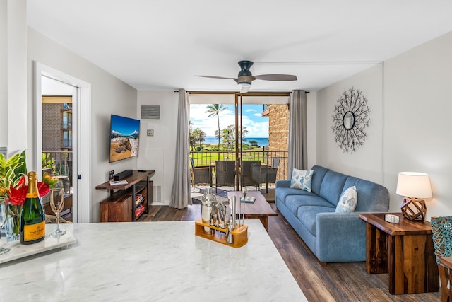 living room featuring dark hardwood / wood-style flooring and ceiling fan