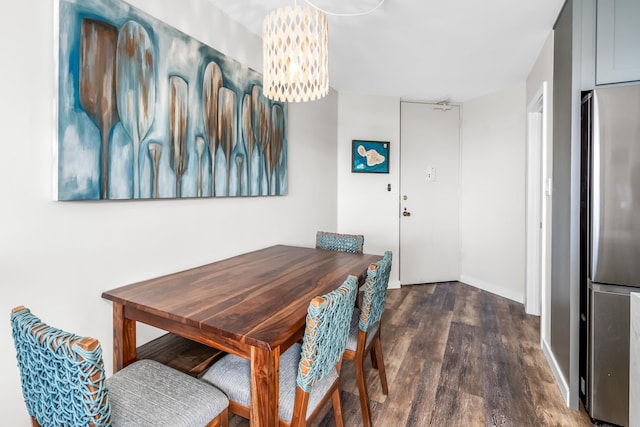 dining room with dark hardwood / wood-style flooring