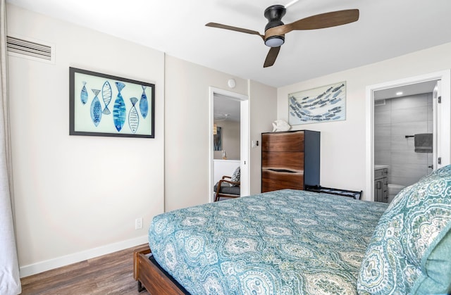 bedroom with ensuite bathroom, dark hardwood / wood-style flooring, and ceiling fan