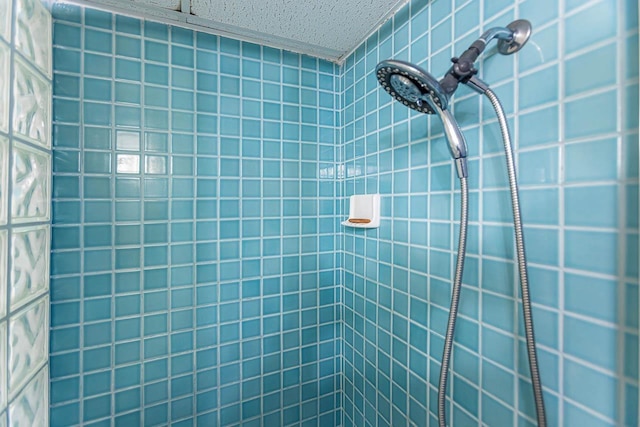 bathroom with a tile shower