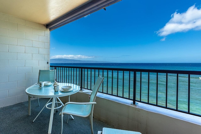 balcony featuring a water view