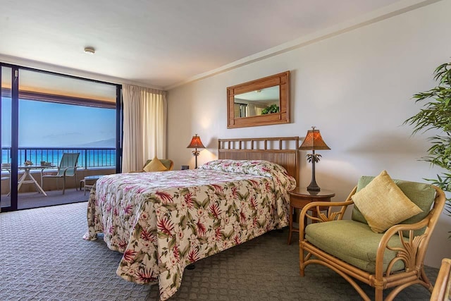 bedroom with carpet, ornamental molding, and access to outside