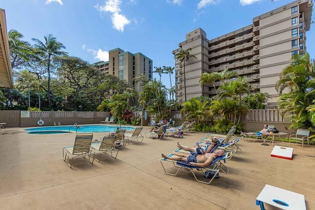 pool featuring a patio and fence