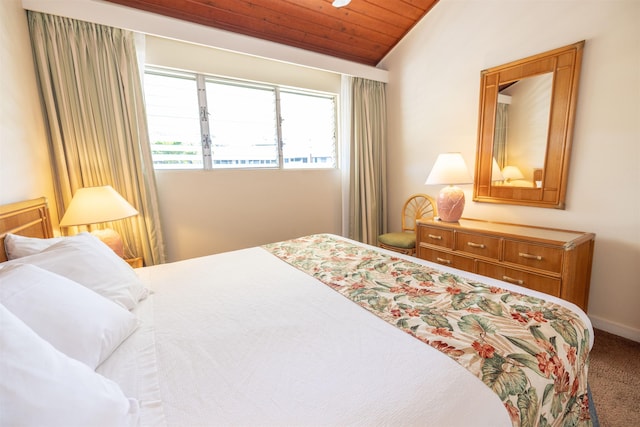 bedroom featuring carpet floors, wooden ceiling, and vaulted ceiling