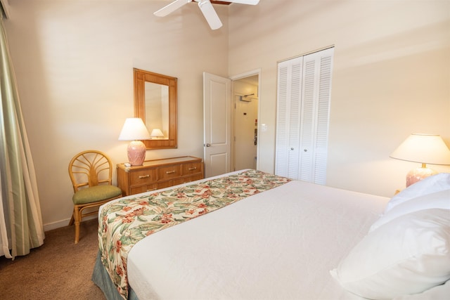 carpeted bedroom with ceiling fan and a closet