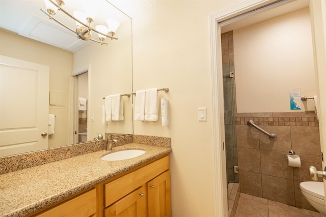 bathroom featuring vanity, tile walls, tile patterned flooring, toilet, and a shower with shower door