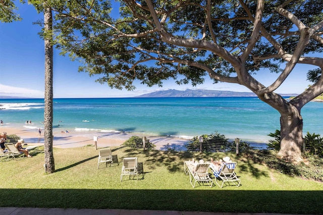 water view with a beach view and a mountain view