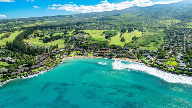 aerial view featuring a water and mountain view