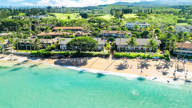 aerial view with a water view and a beach view