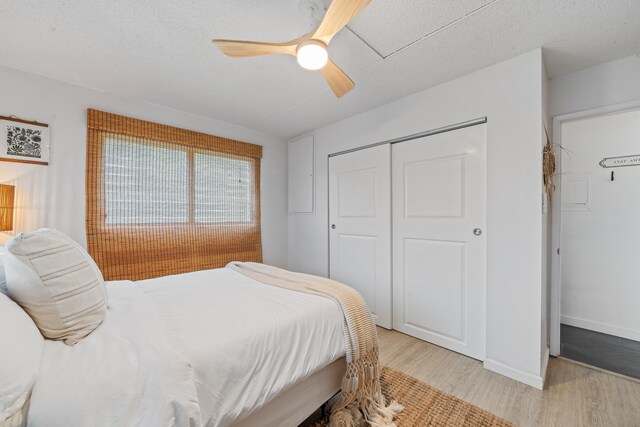 2495 S Kihei Rd Unit 175, Kihei, HI 96753 - bedroom with light wood-style flooring, a closet, ceiling fan, and baseboards