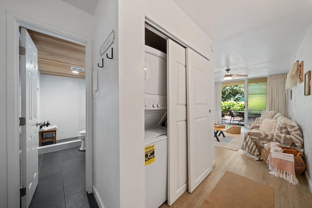 2495 S Kihei Rd Unit 175, Kihei, HI 96753 - laundry room with stacked washing machine and dryer, a ceiling fan, and wood finished floors