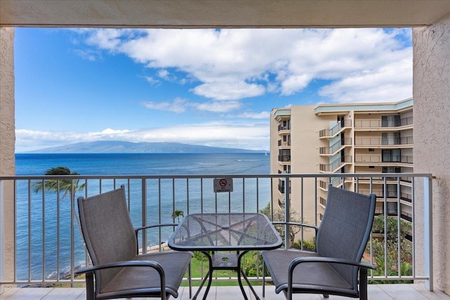 balcony featuring a water view