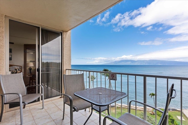 balcony featuring a water view