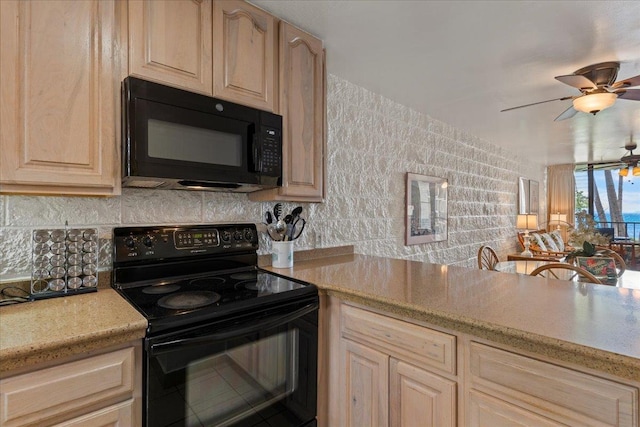 kitchen with light stone counters, black appliances, backsplash, ceiling fan, and light brown cabinets