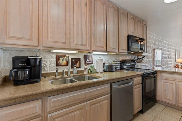 kitchen with sink, light tile patterned flooring, decorative backsplash, light brown cabinetry, and black appliances