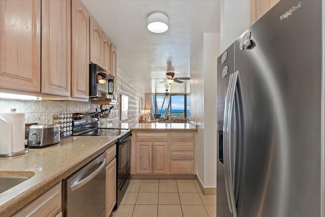 kitchen featuring light tile patterned floors, ceiling fan, black appliances, and light brown cabinets