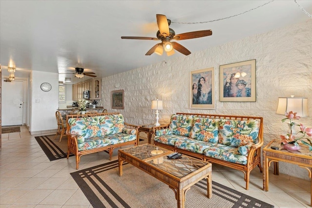 tiled living room with ceiling fan